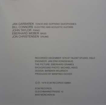 CD Jan Garbarek Group: Photo With Blue Sky, White Cloud, Wires, Windows And A Red Roof
